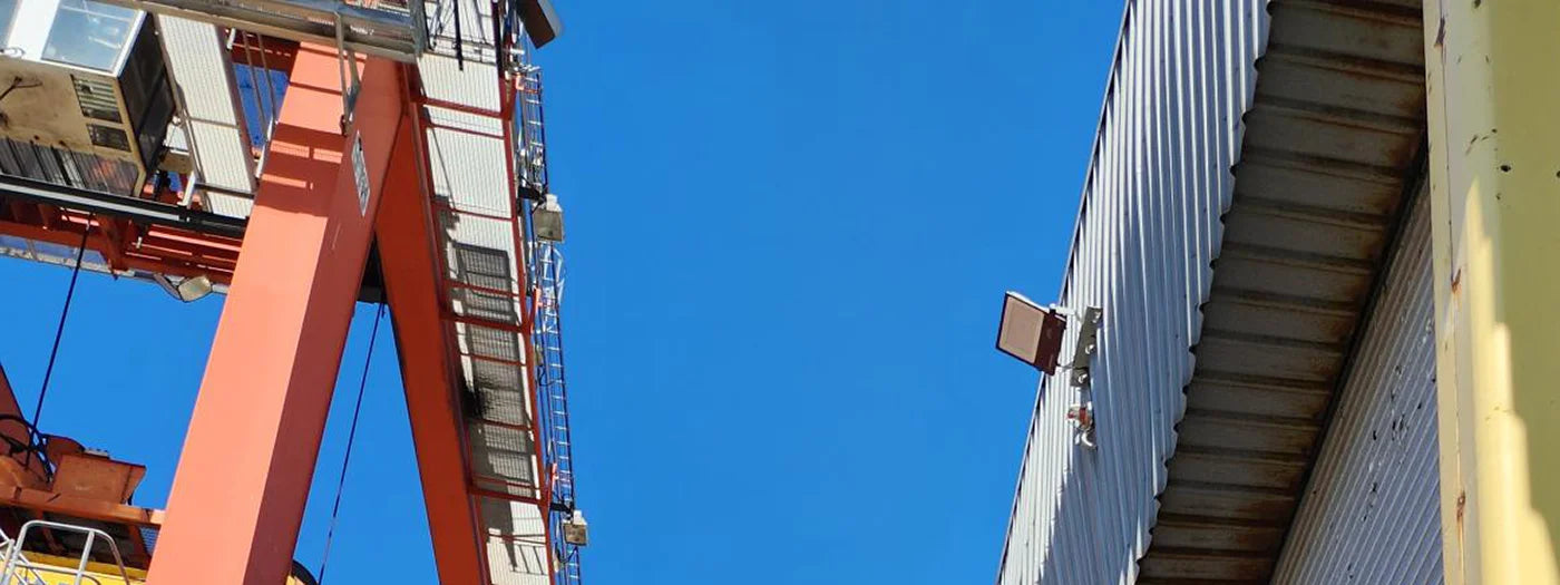 LED flood light installed over marine port crane loading area