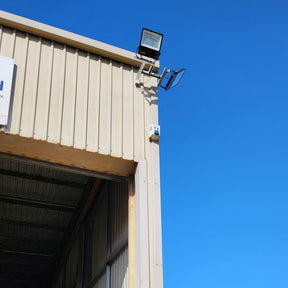 200W LED flood light installed on industrial workshop exterior